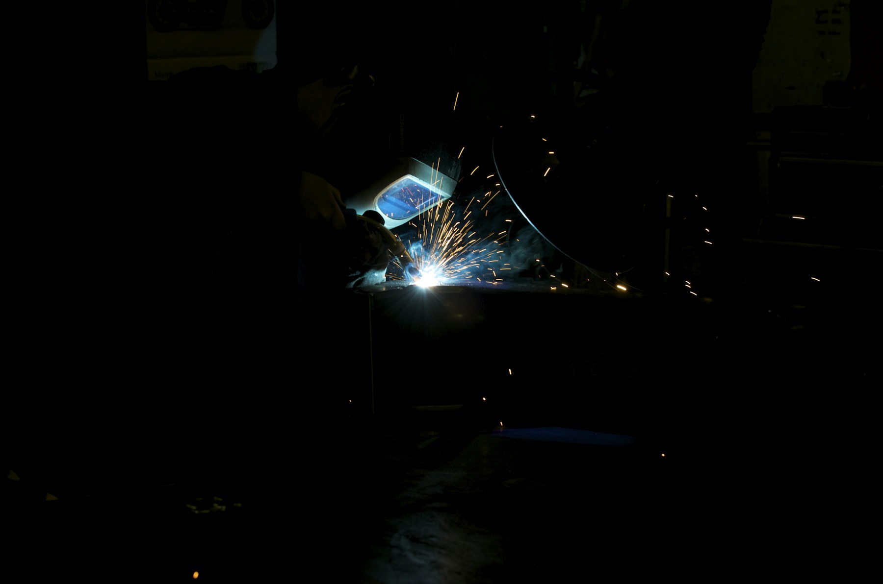 Welding sparks in a fabrication shop